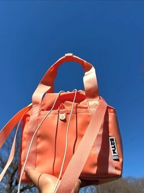 Baboon to the Moon Go-Tote Bucket Bag in Sunset Coral